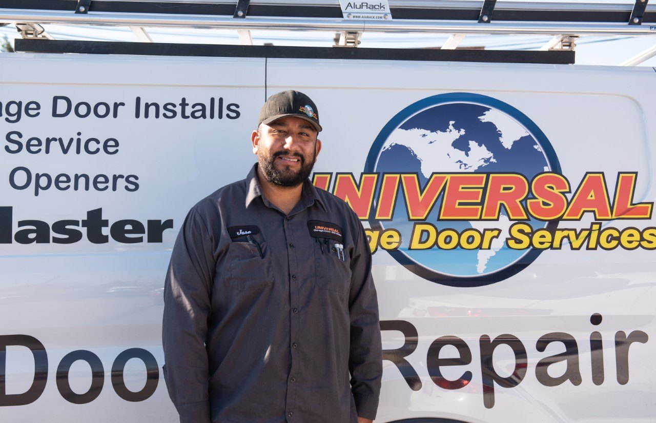 Universal Garage Door Services technician beside a branded service truck